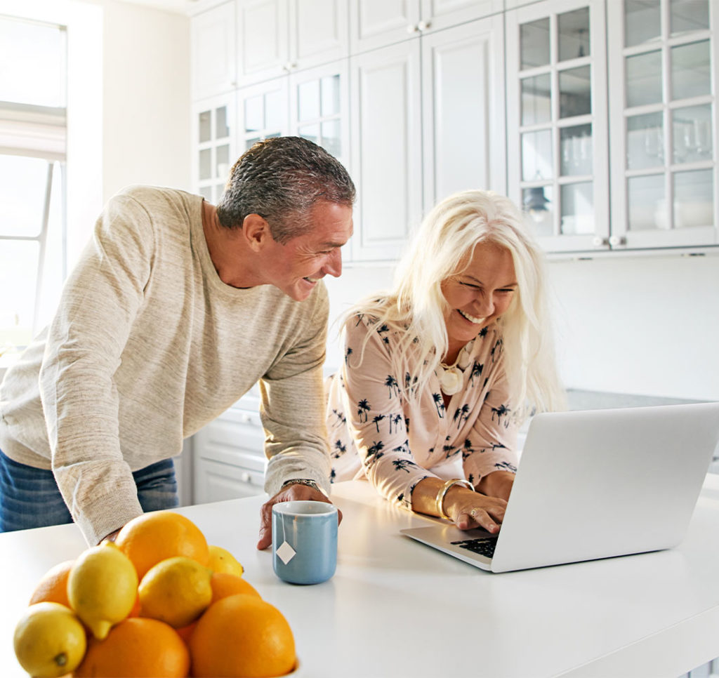 couple on computer together meeting for a webinar